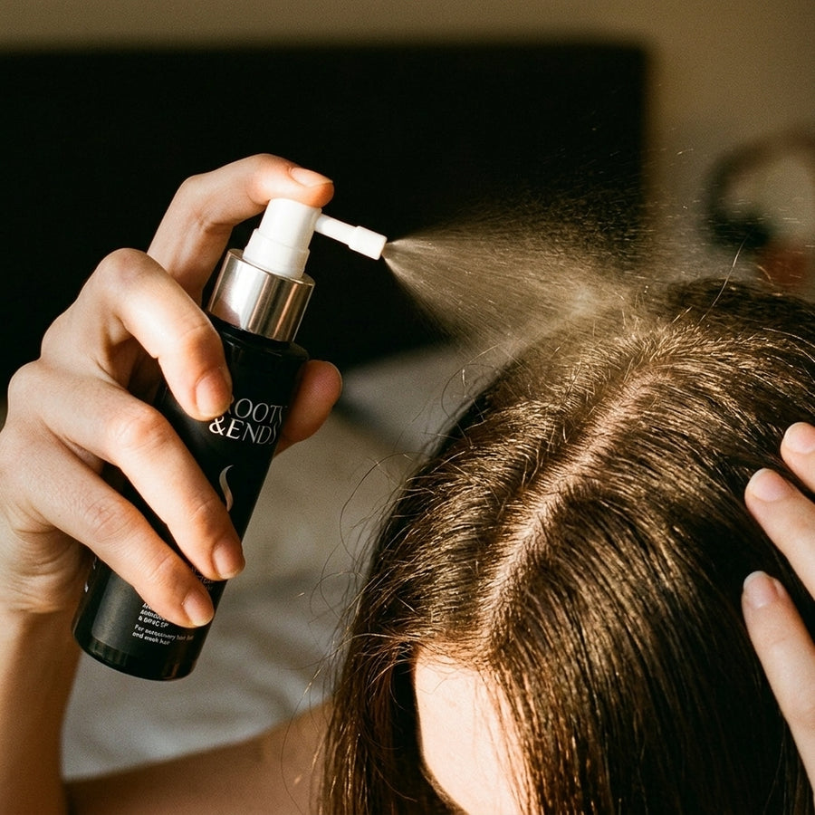 Spraying Roots & Ends onto the scalp at the parting
